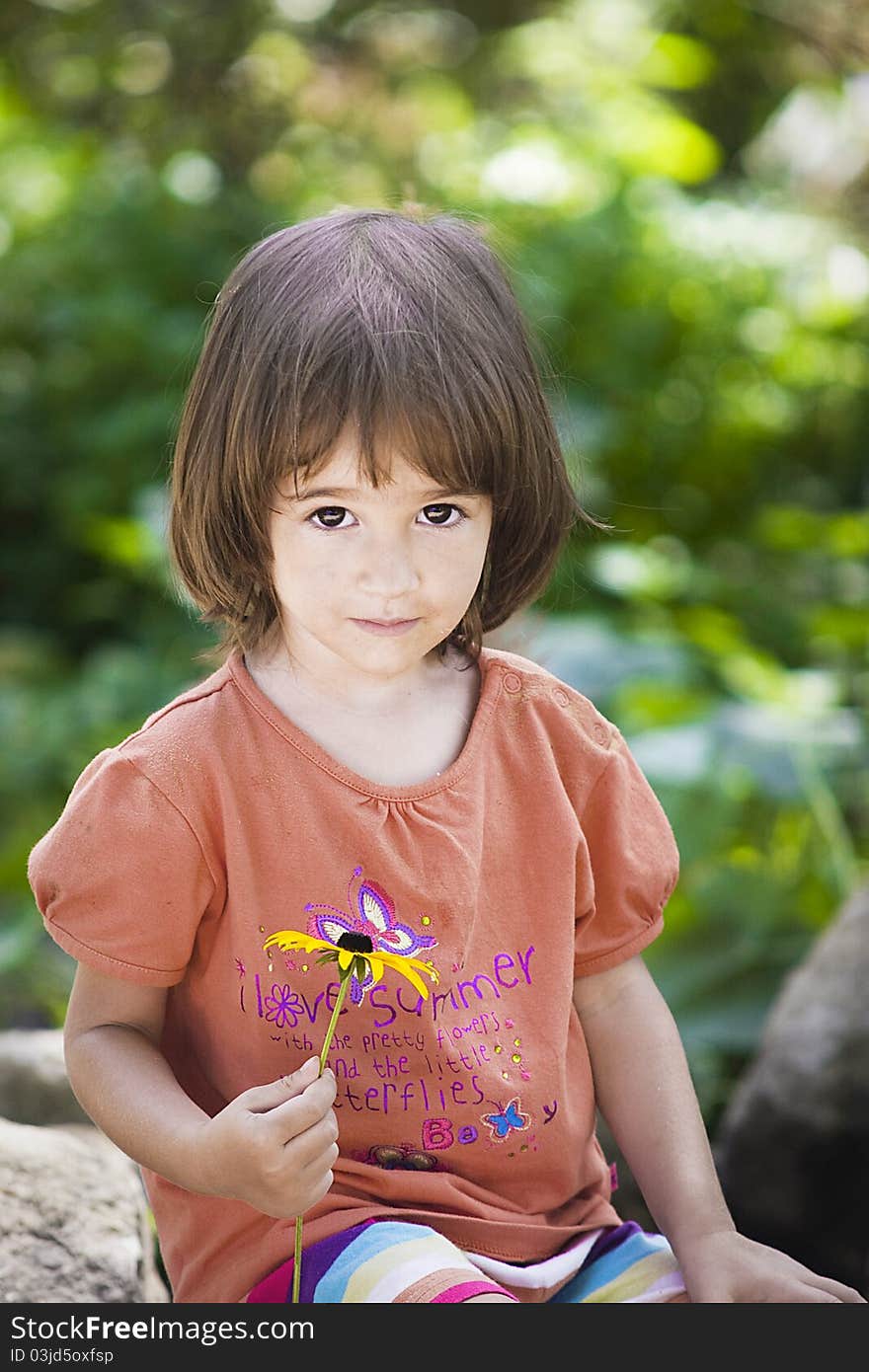 Portrait of a little girl in the garden