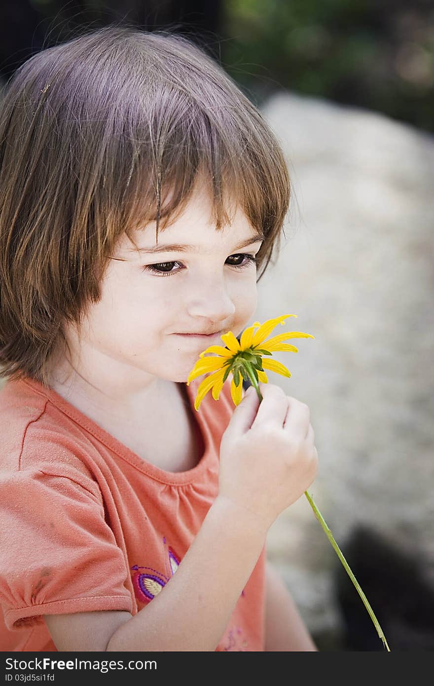 Portrait of a little girl in the garden