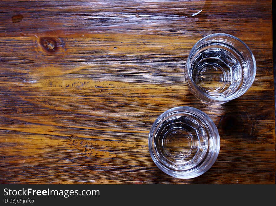 Two glasses of water on wood table