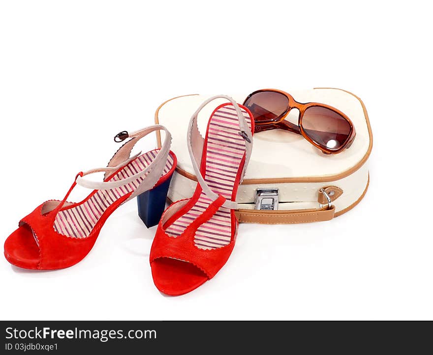 Beautician, shoes and sun glasses over white