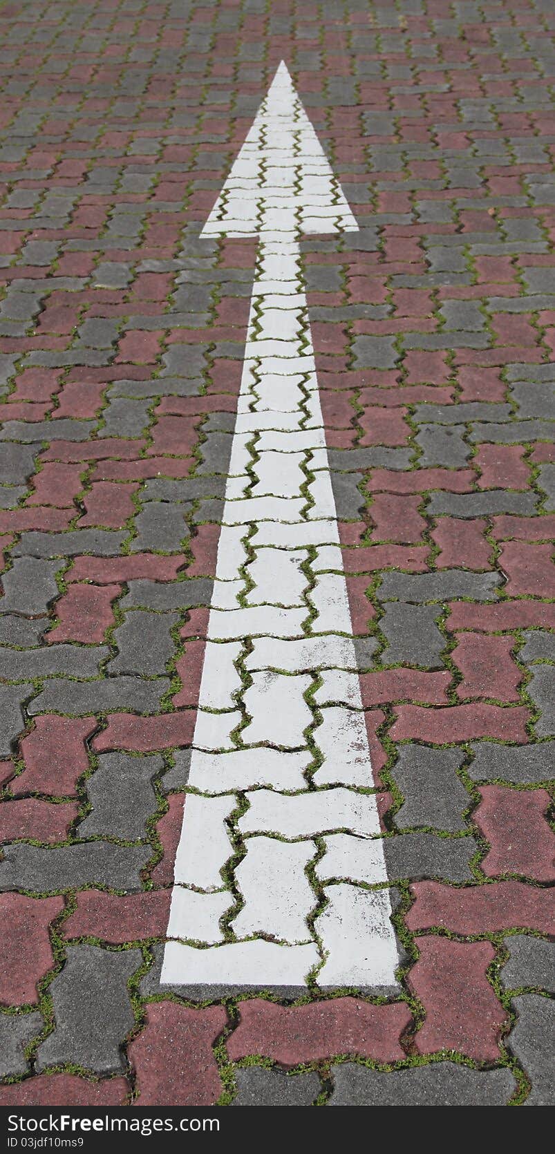 A land mark of go ahead on the brick ground