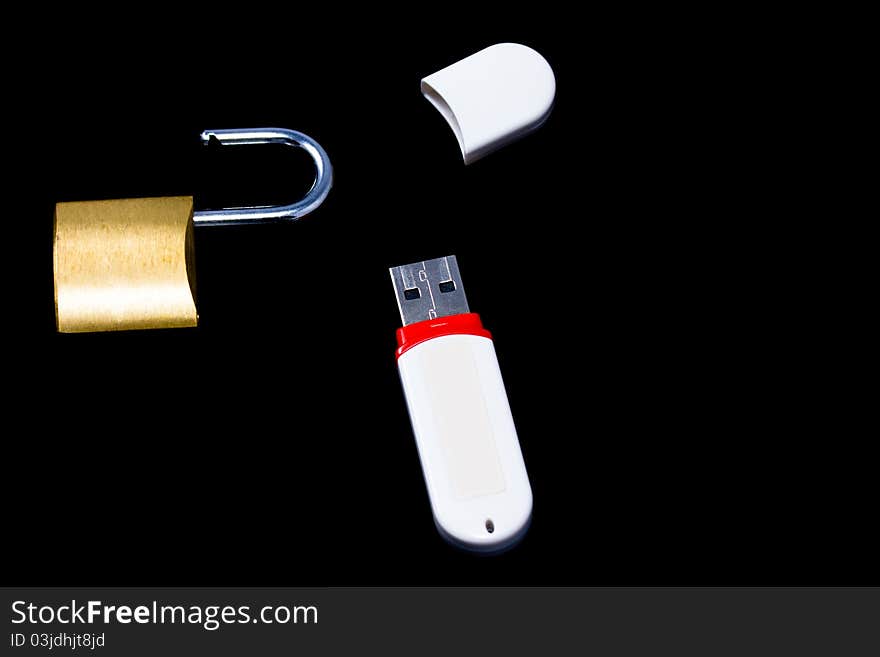 A USB flash disk with an unlock padlock (isolated on black). Concept of an unsecured USB flash disk.