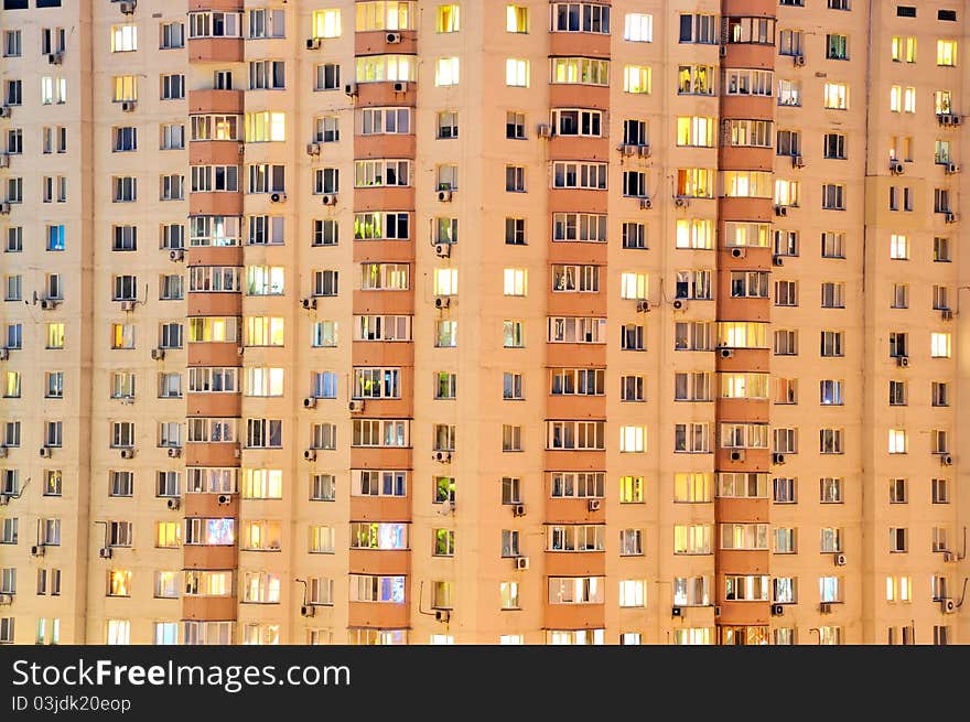 Wall with windows of the building at night