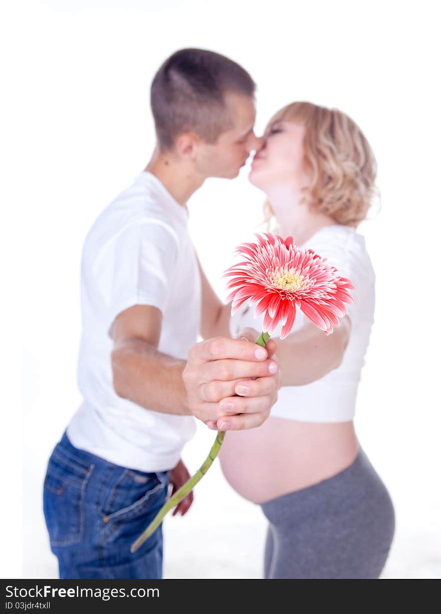 Studio shot of young couple expecting a baby