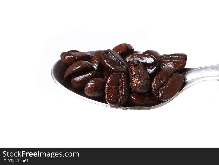 An arrangement of coffee beans on a white background