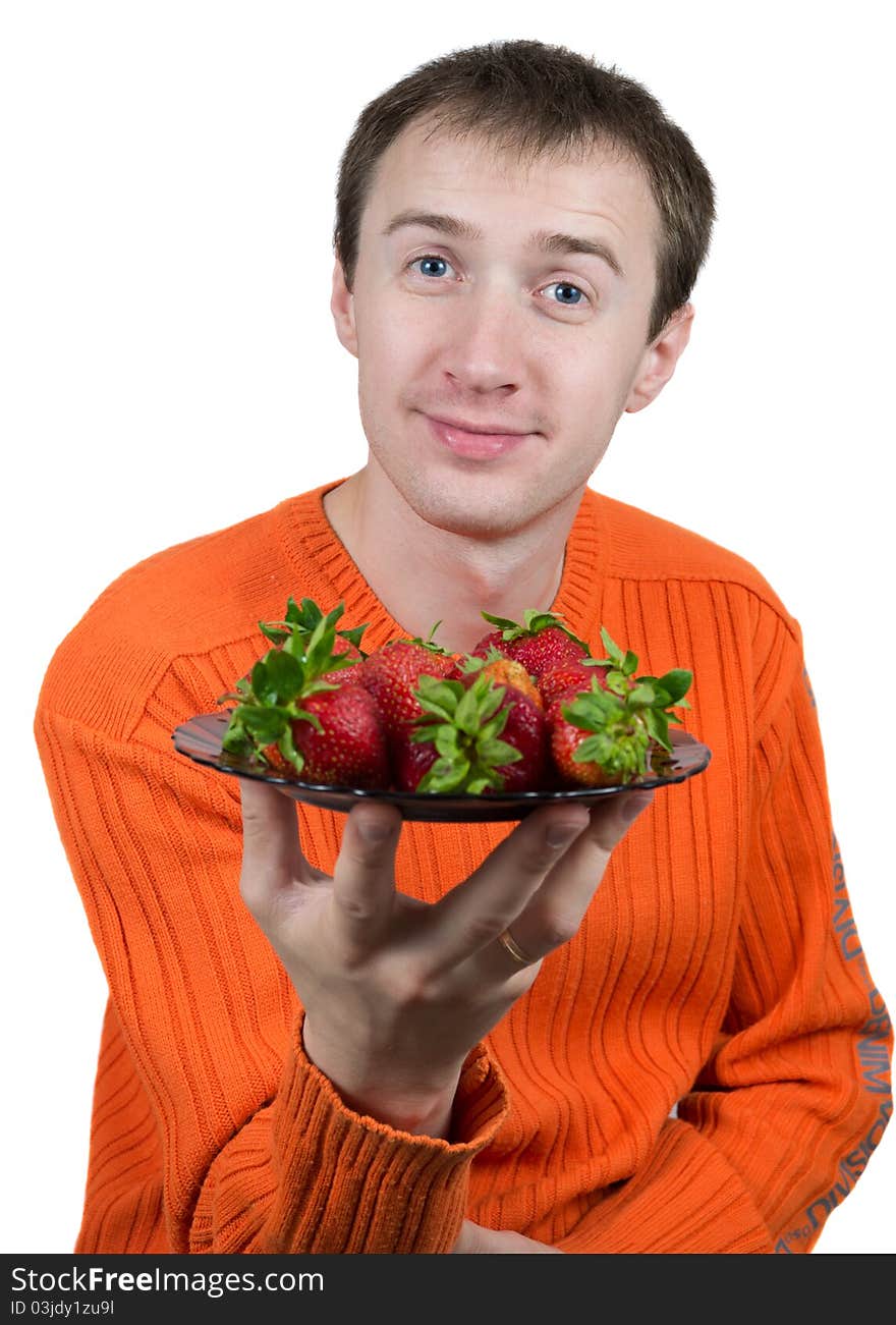 Young man holding a strawberry isolated