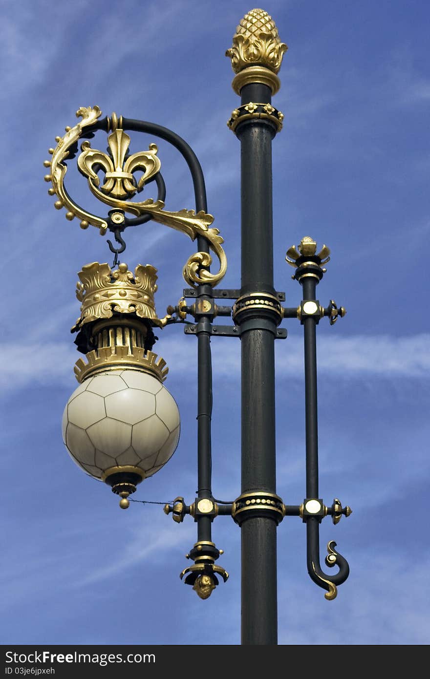 Ornate details on streetlamp in front of Palacio Real. Madrid. Spain. Ornate details on streetlamp in front of Palacio Real. Madrid. Spain