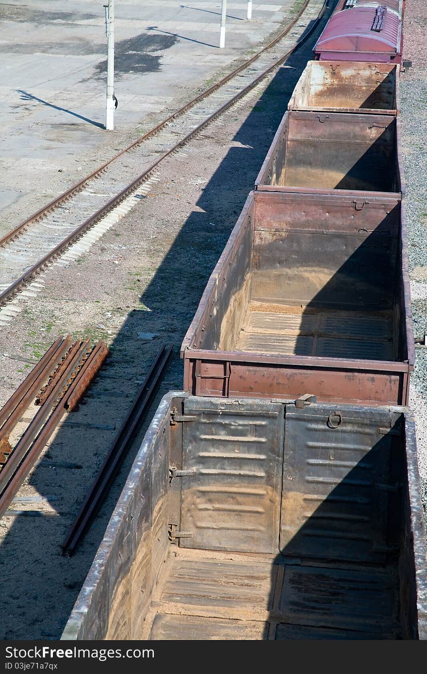 Empty open freight carriers on railroad