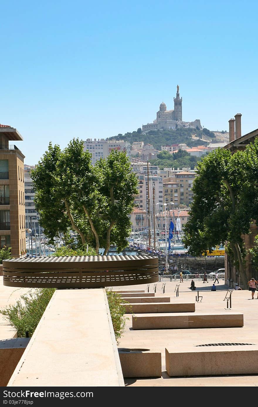 View on port and Notre-Dame de la Garde basilica in Marseilles, France. July 10, 2007. View on port and Notre-Dame de la Garde basilica in Marseilles, France. July 10, 2007