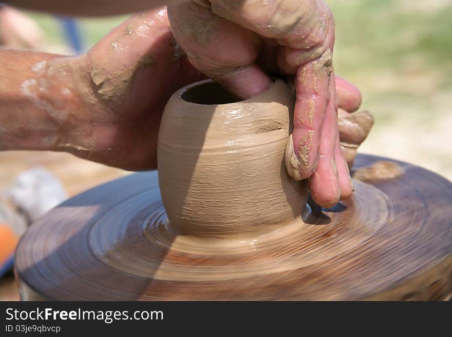 Magic transformation of a piece of clay into the true  utensils. Magic transformation of a piece of clay into the true  utensils.