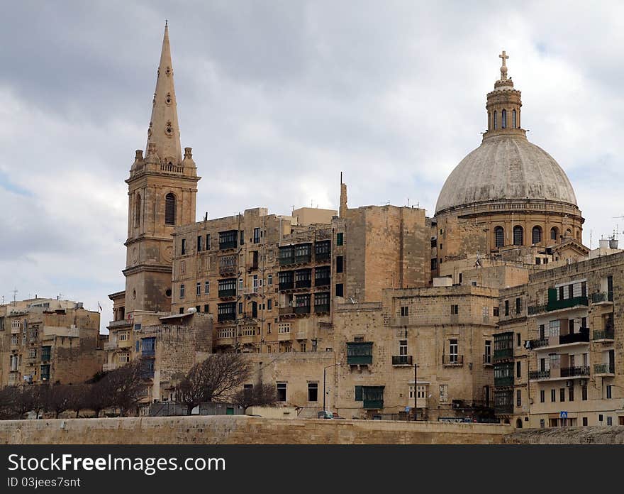 Historic Maltese architecture in the Valletta City on a cloudy day. Historic Maltese architecture in the Valletta City on a cloudy day.