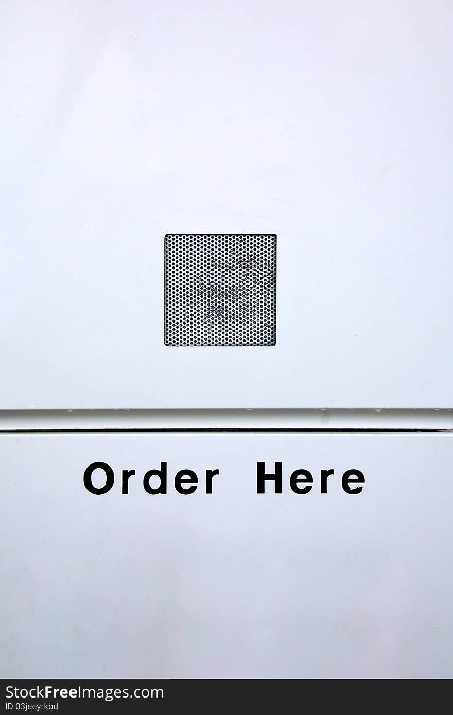 A speaker box and a sign saying order here