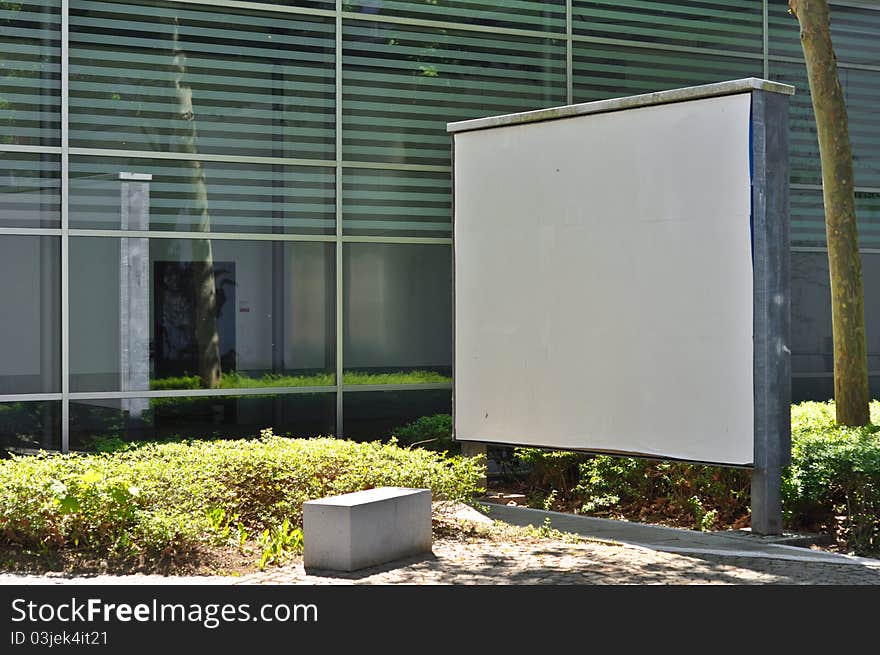 Blank billboard on the background of a modern building