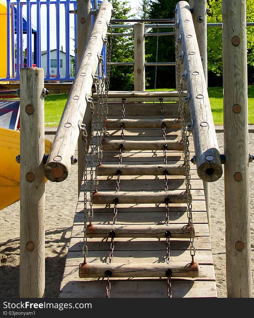 A wooden ladder on a childrens jungle gym. A wooden ladder on a childrens jungle gym