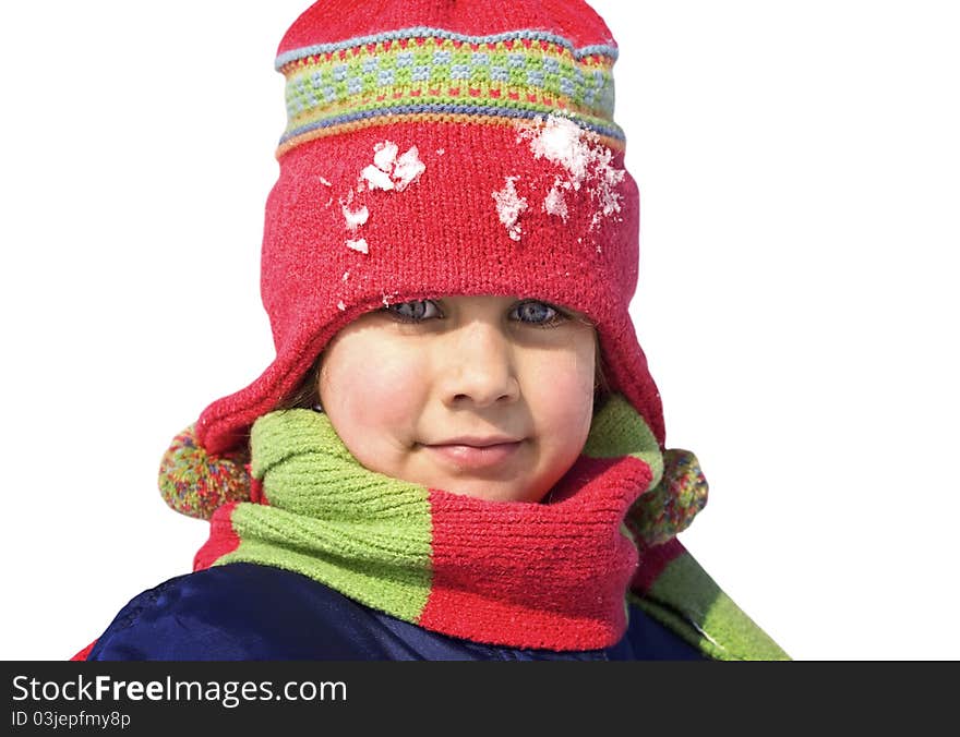 Cute girl in a snowy day isolated on white