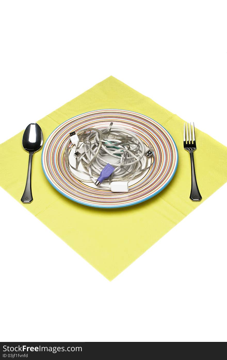 Computer cables on plate with silver ware