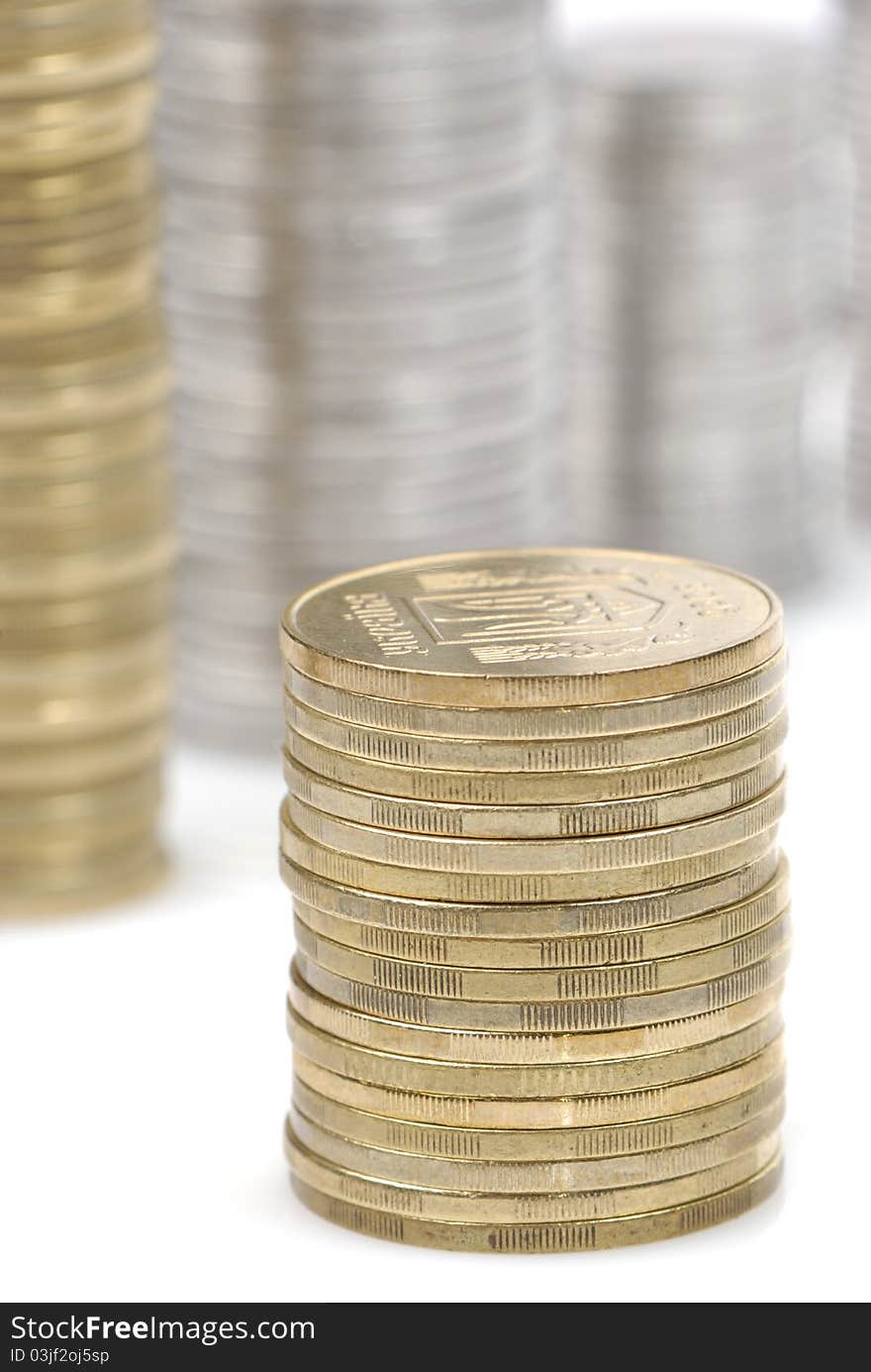 Stacks of coins isolated on white