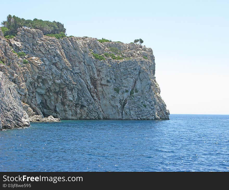 Aegean sea landscape view of high rock. Aegean sea landscape view of high rock