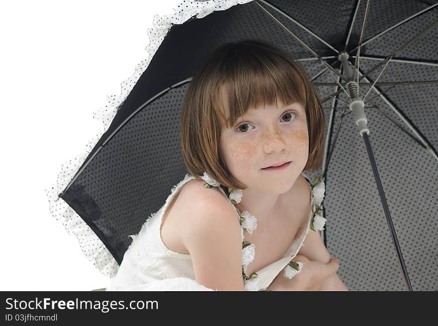 Freckled model posing with umbrella