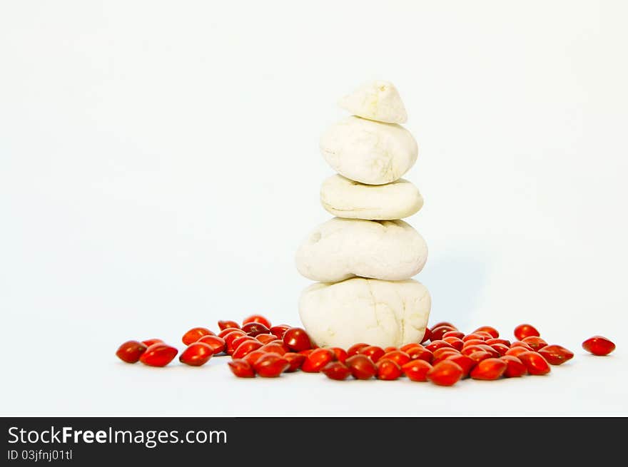 Pile of five stones white tinged with red seeds. Pile of five stones white tinged with red seeds