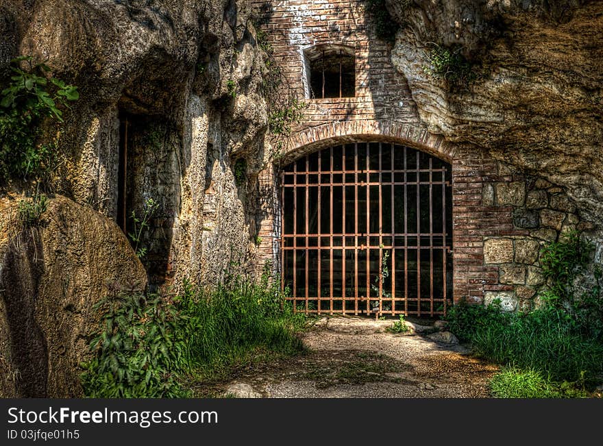 Ruin of an old watermill, built into the rocks of Bagno Vignoni