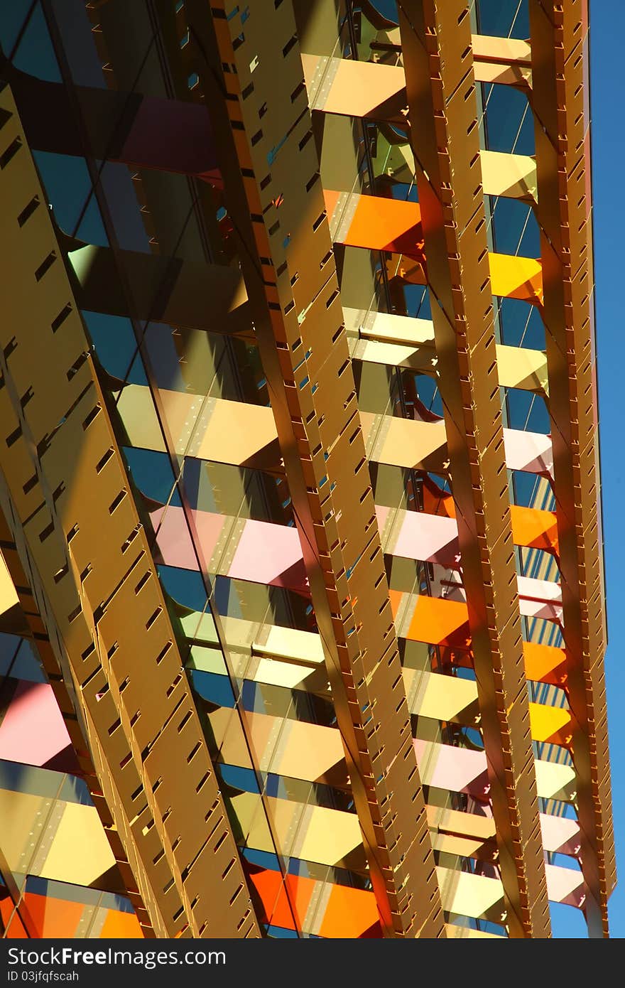 View of side of office building with bright colored metal grate blinds. View of side of office building with bright colored metal grate blinds