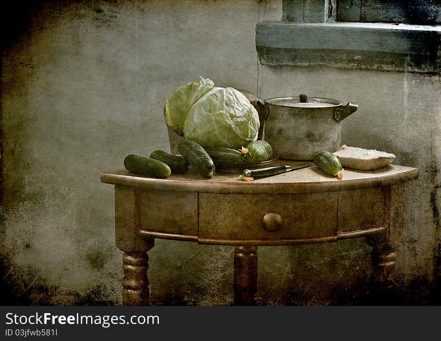 Still life with a cabbage and cucumbers