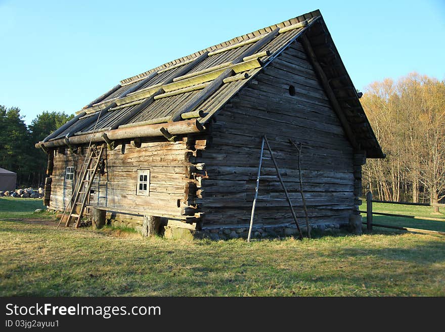 Ancient house at open-air museum in spring, Latvia. Ancient house at open-air museum in spring, Latvia.