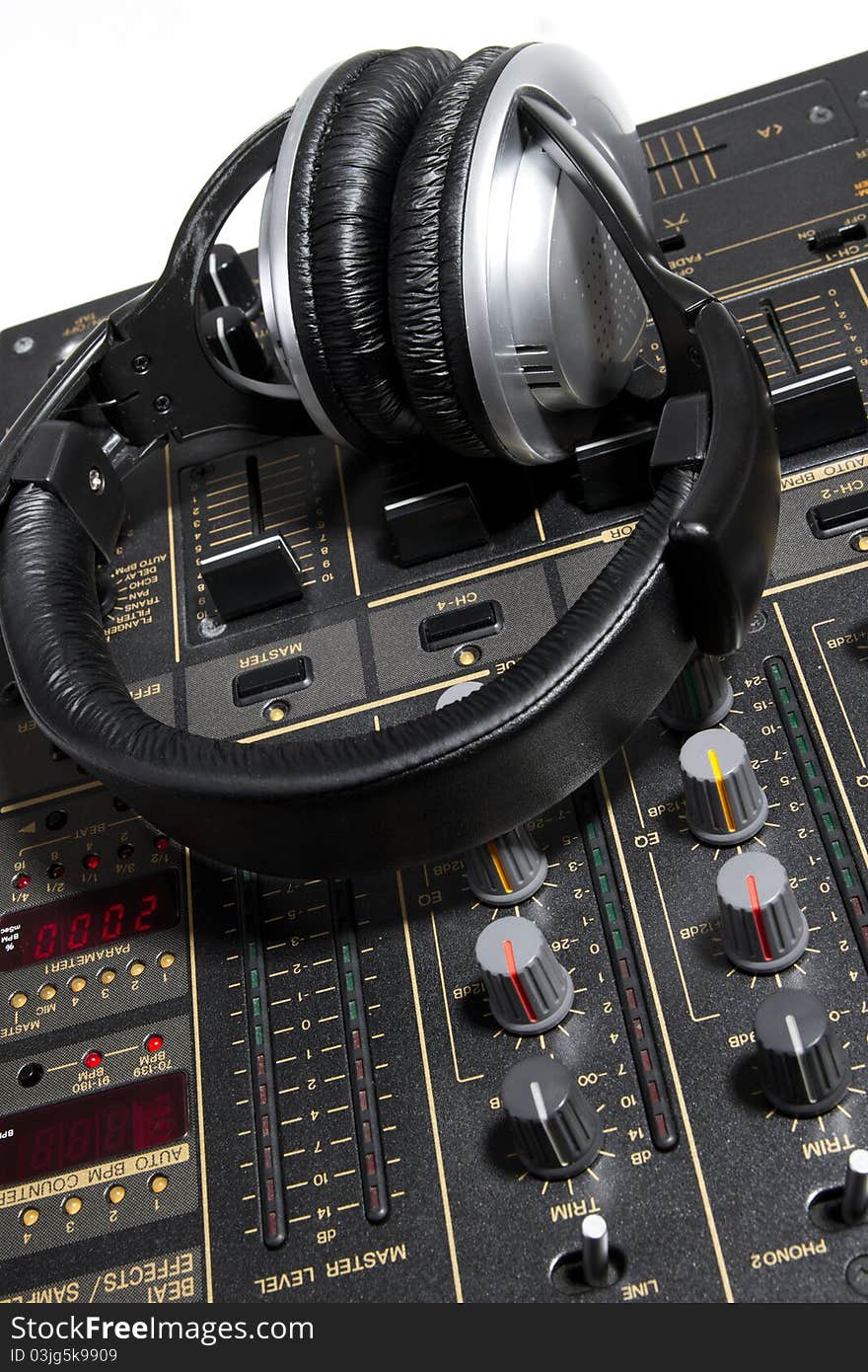 Professional DJ stereo headset on mixing controller. Professional DJ stereo headset on mixing controller