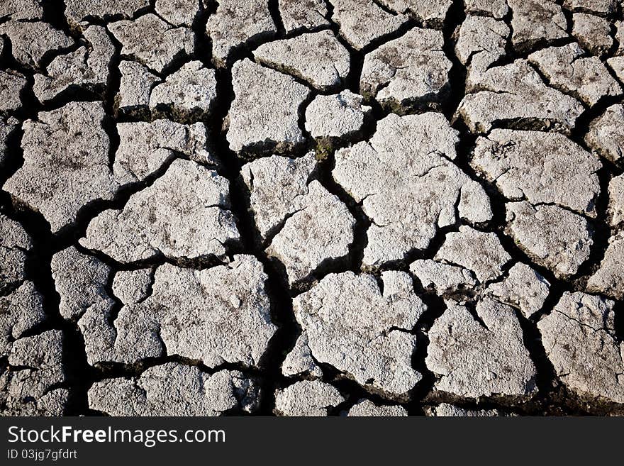 Land with dry cracked ground. Land with dry cracked ground