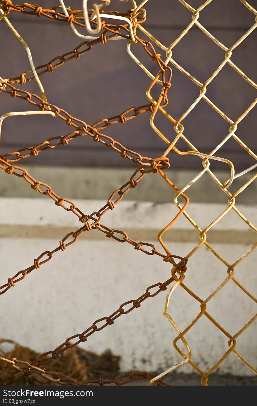 This fence has seen better days. Small chain is being used to secure open area of chain link fencing. This fence has seen better days. Small chain is being used to secure open area of chain link fencing.