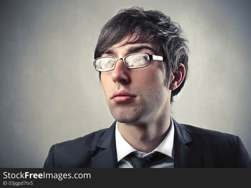 Young businessman wearing stained glasses. Young businessman wearing stained glasses