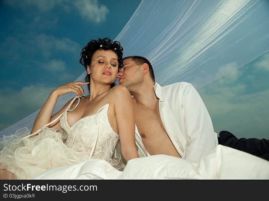 Wedding shot of sexy passion between bride and groom