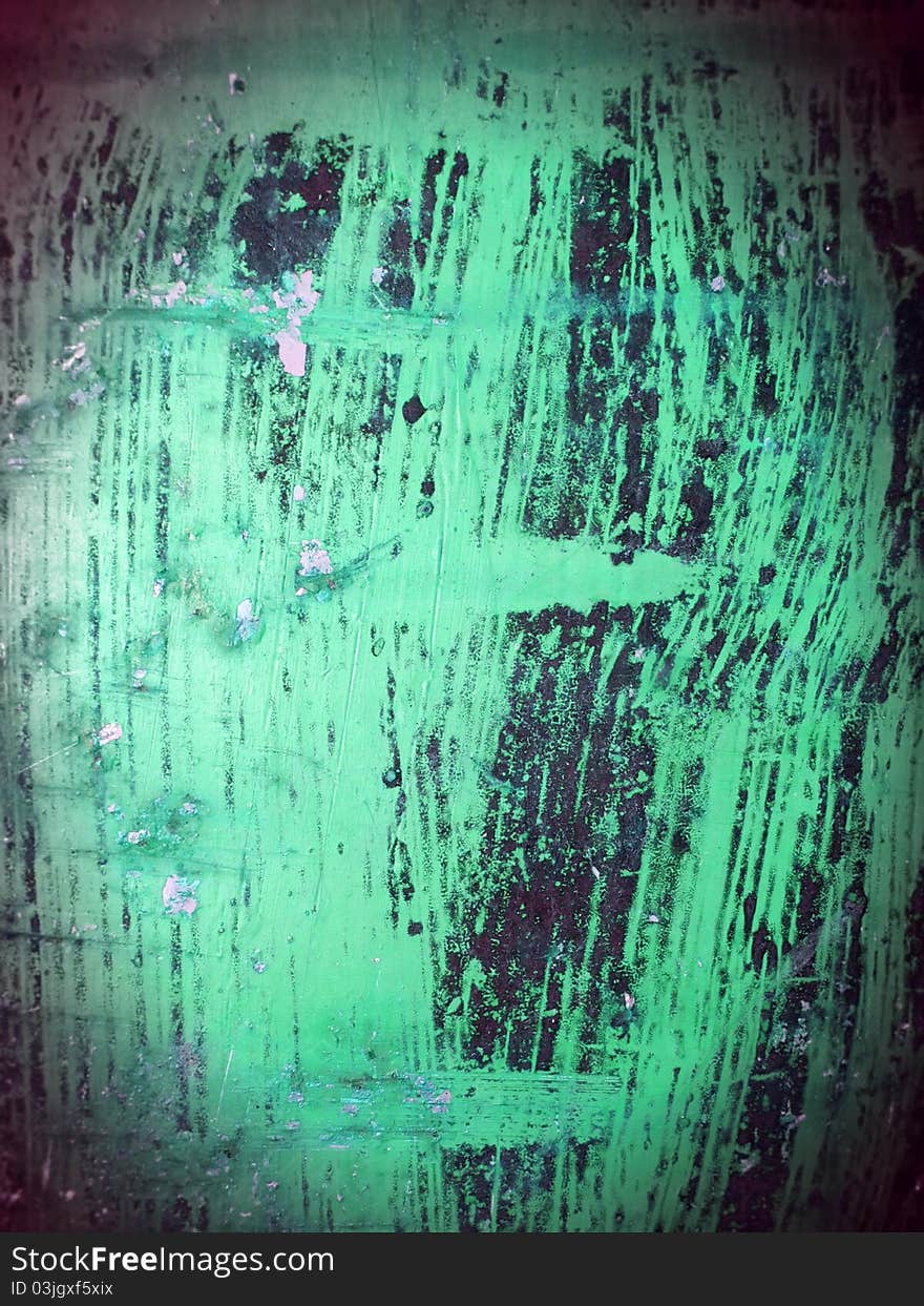 Green painted metal with rust and scratches