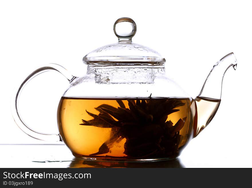 Tea in glass pot isolated