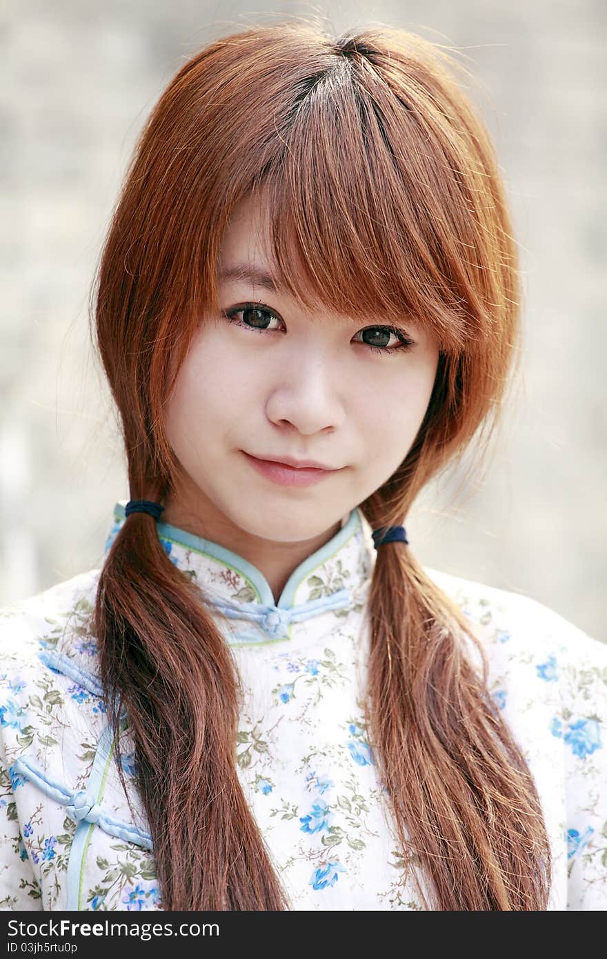 Chinese girl in traditional dress outdoor portrait. Chinese girl in traditional dress outdoor portrait.