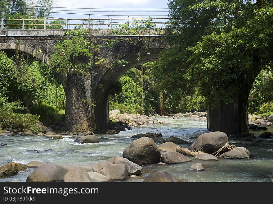 Bridge across the mountain river on Bali island, Indonesia. Bridge across the mountain river on Bali island, Indonesia