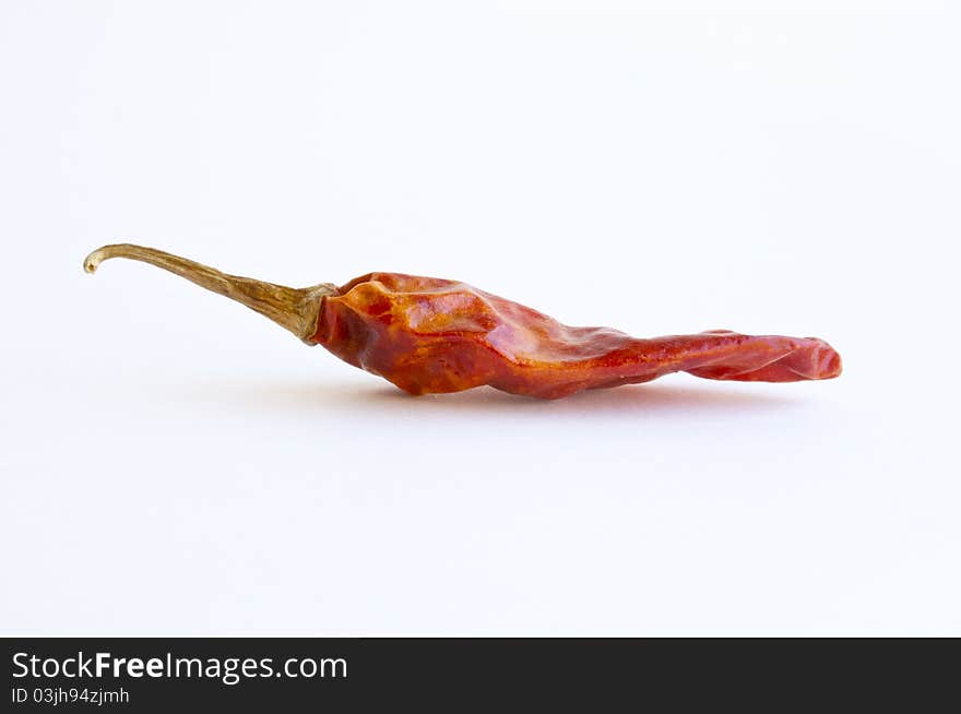 Dried red hot chili pepper, isolated on white background.