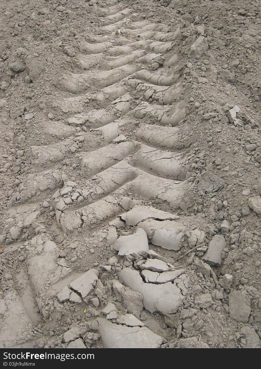 Track in the field made by a tractor