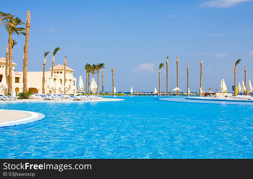 Swimming pool are under the open sky ashore the Red sea . Egypt . Swimming pool are under the open sky ashore the Red sea . Egypt .