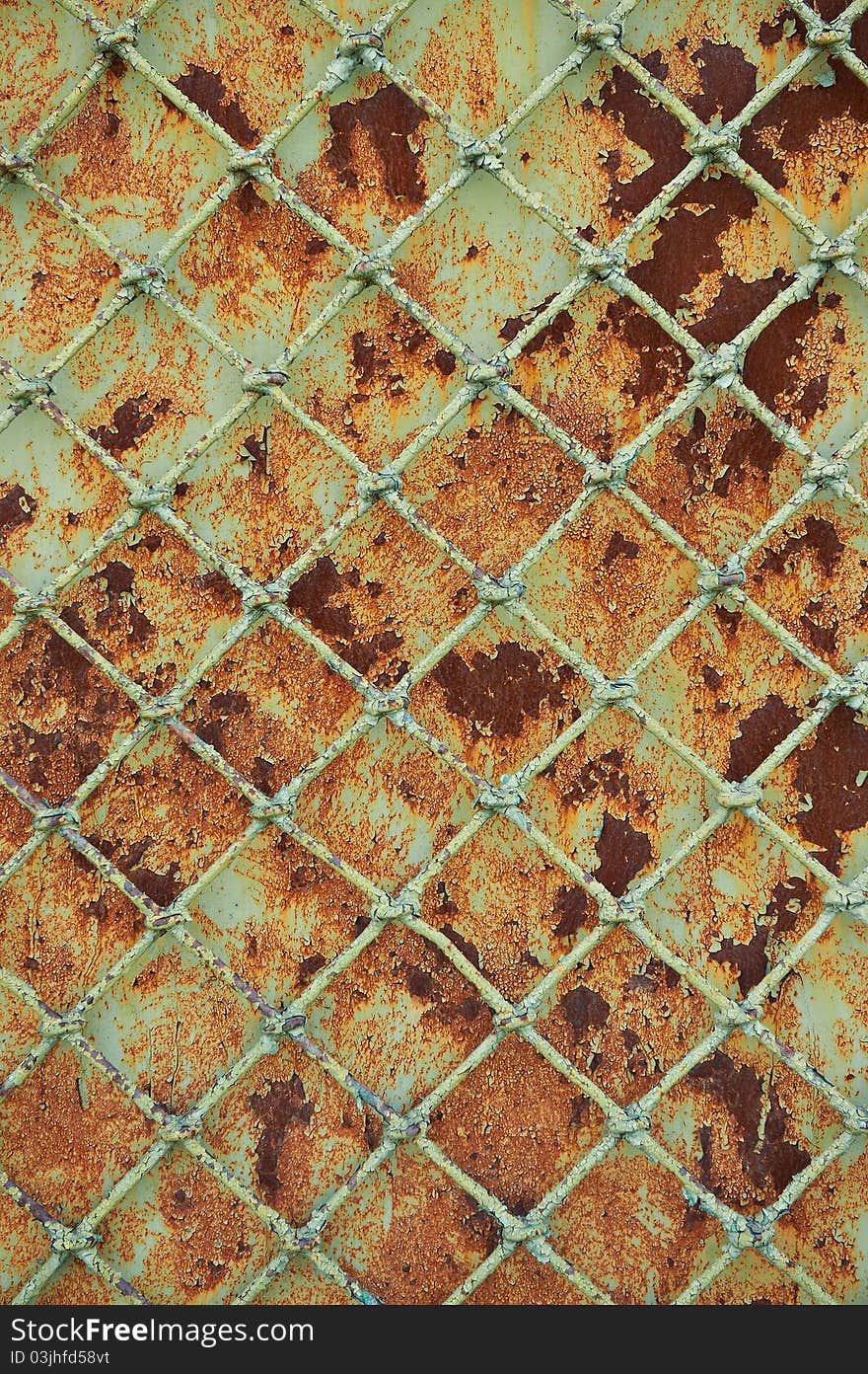 Old metal grill fence with peeling paint. Old metal grill fence with peeling paint