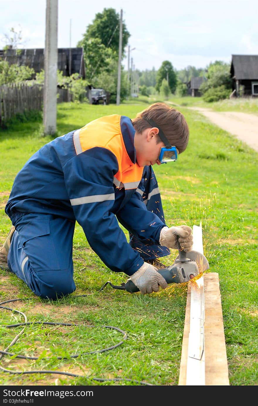 Young Man Carving Steel