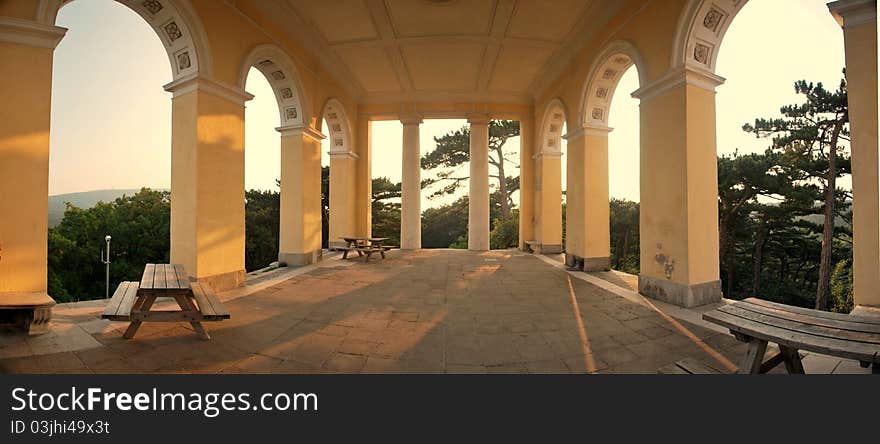 Great temple at top of a mountain in the sunset