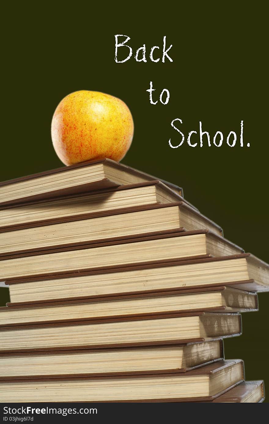 An apple on top of stack of books isolated on green. An apple on top of stack of books isolated on green