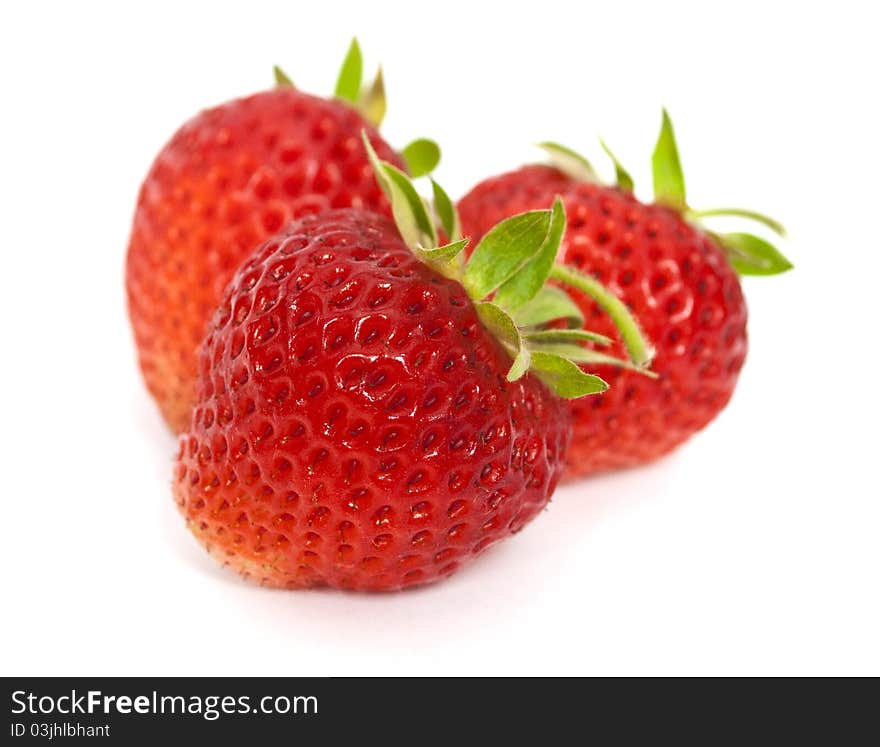 Three tasty strawberries isolated on the white background. Three tasty strawberries isolated on the white background