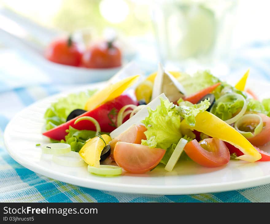 Gresh vegetable salad with cheese. Shallow depth, selective focus