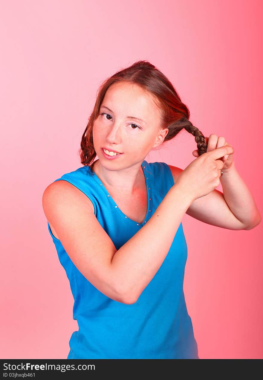 Young woman making a hair braid