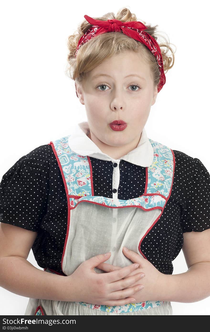 Adorable blonde child model wearing retro apron and head scarf. Adorable blonde child model wearing retro apron and head scarf