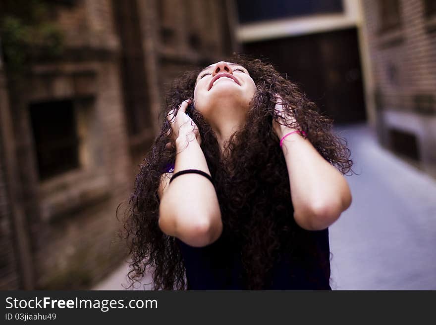 Young beautiful girl enjoying music from her headphones. Young beautiful girl enjoying music from her headphones.