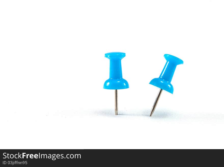 Close up of a pushpin on white background. Close up of a pushpin on white background